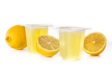 Lemon jellies on a plastic cup isolated on white background	