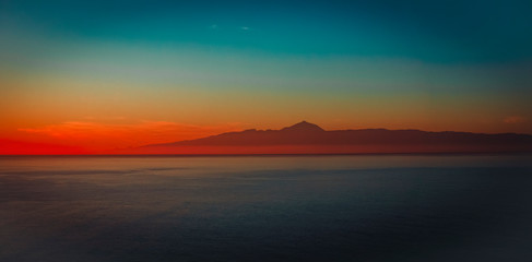 Fototapeta na wymiar Sunset at sea in Grand Canaria with view on Teide, panorama