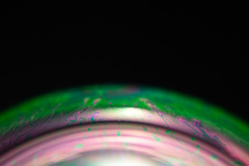 Macro of part of soap sphere on black background
