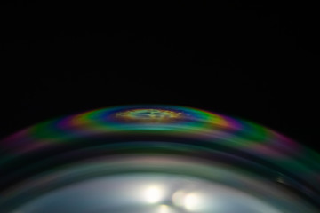 Macro of part of soap sphere on black background