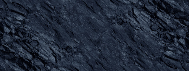 Monochrome mountain texture. Toned stone background. Dark blue rock background. Gray blue grunge...