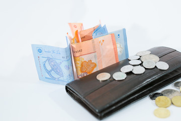 Banknotes and coins on white background