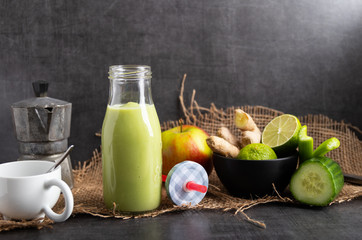 Detox smoothie with ginger, cucumber, apple and lemon.