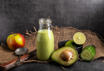 Detox smoothie with avocado, cucumber, apple and lemon.