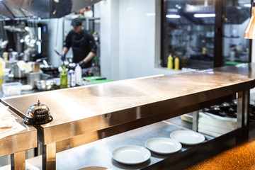 Dishes of ready meals in a restaurant and kitchen in the background