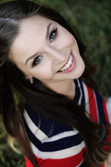 Outdoors portrait of a beautiful young woman smiling