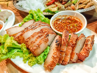tasty slice Grilled pork or Pork Neck and belly Grilled , most popular traditional and Recommended Menu Thai food. The most delicious Grilled Pork Neck with Thai Spicy Sauce. Popular menu in Thailand.