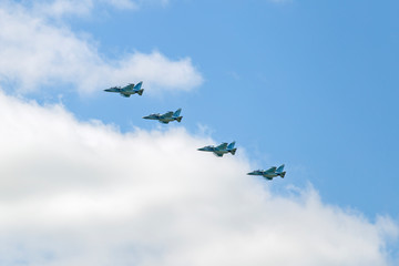 Russian Military jet in the air. Silhouettes of russian fighter aircrafts in the sky. military aircrafts flying together in the sky during airshow