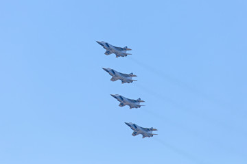 Russian Military jet in the air. Silhouettes of russian fighter aircrafts in the sky. military aircrafts flying together in the sky during airshow