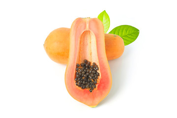 Whole and half of ripe papaya fruit with seeds on white background