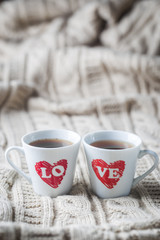 Two Cup of coffee with LOVEtextile background in retro tone Love concept ,Background for Valentine with copy space