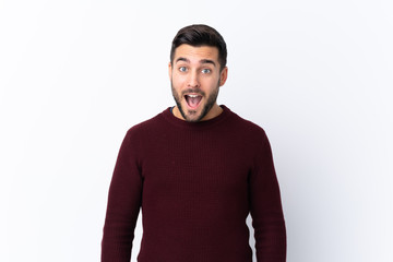 Fototapeta premium Young handsome man with beard over isolated white background with surprise facial expression