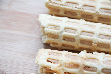 Homemade wafer rolls on cutting desk. Traditional russian cuisine. Close-up photo, space for text.