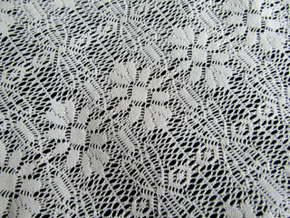 White lace on the black background backdrop               