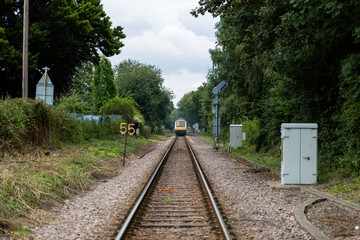 Fototapeta na wymiar Passenger train on the tracks leaving or arriving at the station