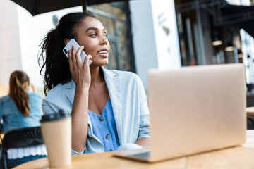 Attractive smiling young african businesswoman