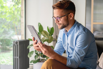 Young Man holding digital tablet	
