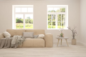 Stylish room in white color with sofa and summer landscape in window. Scandinavian interior design. 3D illustration