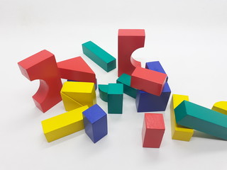 Obraz premium Artistic Handmade Colorful Various Shape Wooden Building Blocks Kid Toys for Playing and Creative Educational Purpose in White Isolated Background
