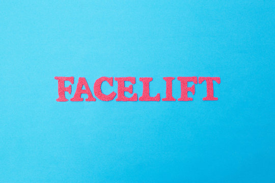 Word facelift in red letters on a blue background. Concept of modern facelift cosmetology procedure, cosmetology