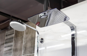 Selling stylish and modern head showers with a water nozzle. Sale of new plumbing, close-up,...