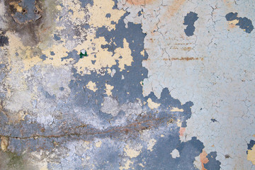 Layers of peeling paint on old wall