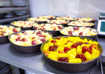 Fresh summer cake with fresh strawberries and pineapple berries in syrup for dessert, decoration