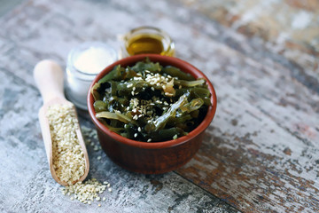 Sea kale with sesame seeds and olive oil. Healthy seafood. Omega 3. Trace elements. Diet food.