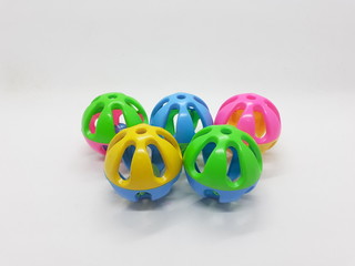 Various Colorful Cute Plastic Balls Design with Bells Ringer Sound Inside for Children or Pet Toys and Educational Purpose in White Isolated Background