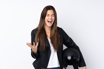 Young woman with a motorcycle helmet over isolated white background unhappy and frustrated with something