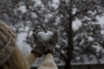 Woman snow heart