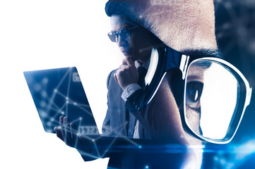 The double exposure image of the businessman using a laptop overlay with source code and programmer image and copy space. The concept of programming, cyber security, business and internet of things.