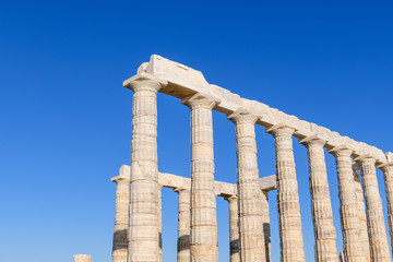 Fototapeta premium Ruins of ancient Temple of Poseidon at Cape Sounion in Attica, Greece