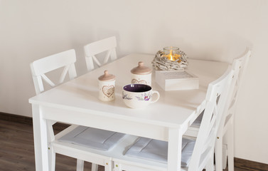 White porcelain mug on white table