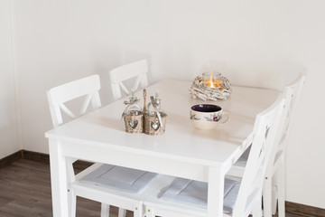 White porcelain mug on white table