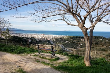 The view from Eratinis street lookout at Patras city in Greece with tree and bench for relaxation and see the beautiful cityscape at sunrise