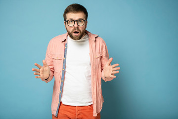 It's impossible. Stunned bearded man opened his mouth in surprise and looks with big eyes into the...