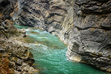 Chegem waterfalls in winter, icy water falls from the mountain