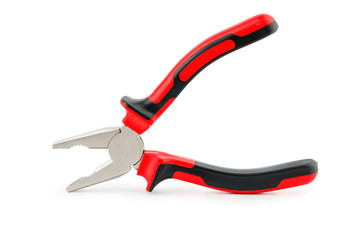 Obraz premium The pliers are red and black on a white background