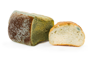 Mouldy bread on a white background. Expired pastries