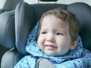 child in a car seat. Child safety in the childs car seat during sleep.