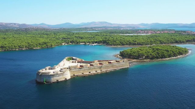 Saint Nicholas fortress at Sibenik bay entrance, Dalmatia, Croatia, drone aerial footage of beautiful blue coastline seascape