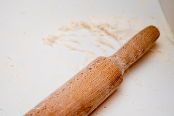 rolling pin on the table with flour