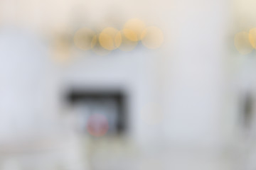 Classic interior with christmas tree, fireplace, lounge armchair, wall panels, wood floor. Image