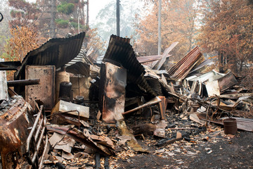 Fototapeta na wymiar Australian bushfire aftermath: Burnt building ruins and rubble at Blue Mountains, Australia
