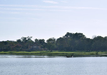 landscape of wooden fishery boat on river in Vietnam