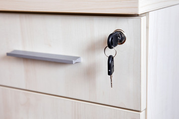 Key in office cabinet drawer lock