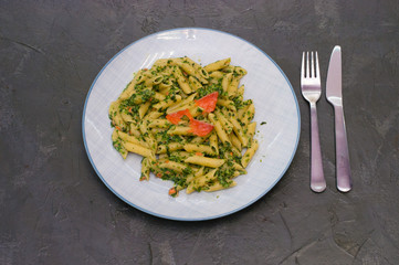 Delicious traditional Italian dish pasta with salmon, spinach and cheese.