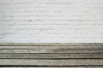 white brick wall and wood floor