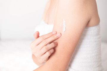 Woman applying arm cream,lotion , Hygiene skin body care concept..